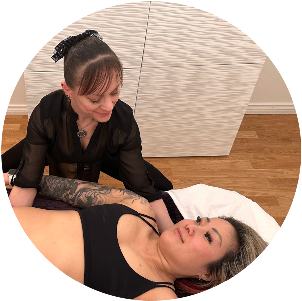 Brandi Abele RMT providing craniosacral assessment and treatment to the occiput and sacrum